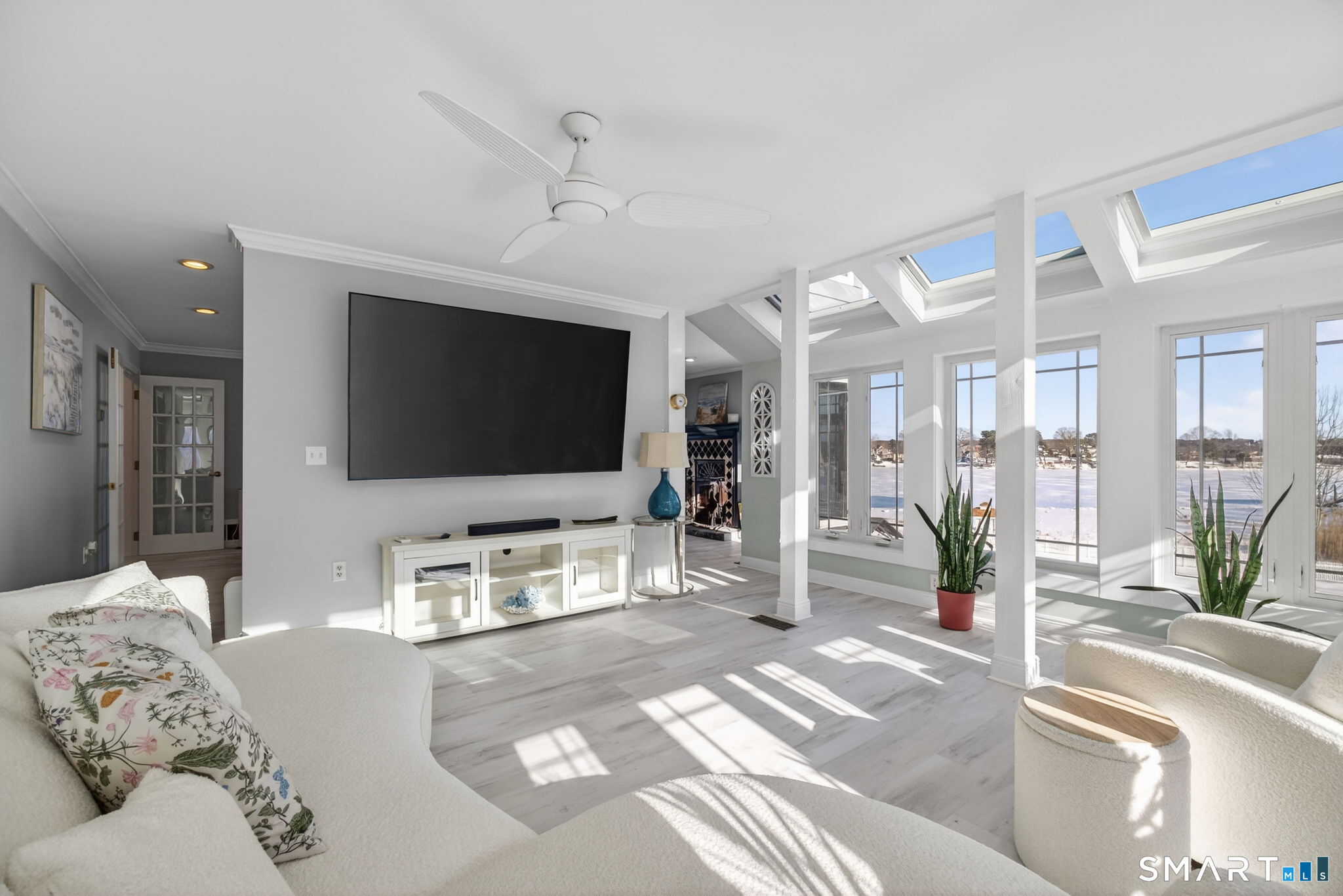 47 Oswegatchie Hills Road East Lyme, CT 06357 - Photo 12 of 40 a living room with furniture and a flat screen tv