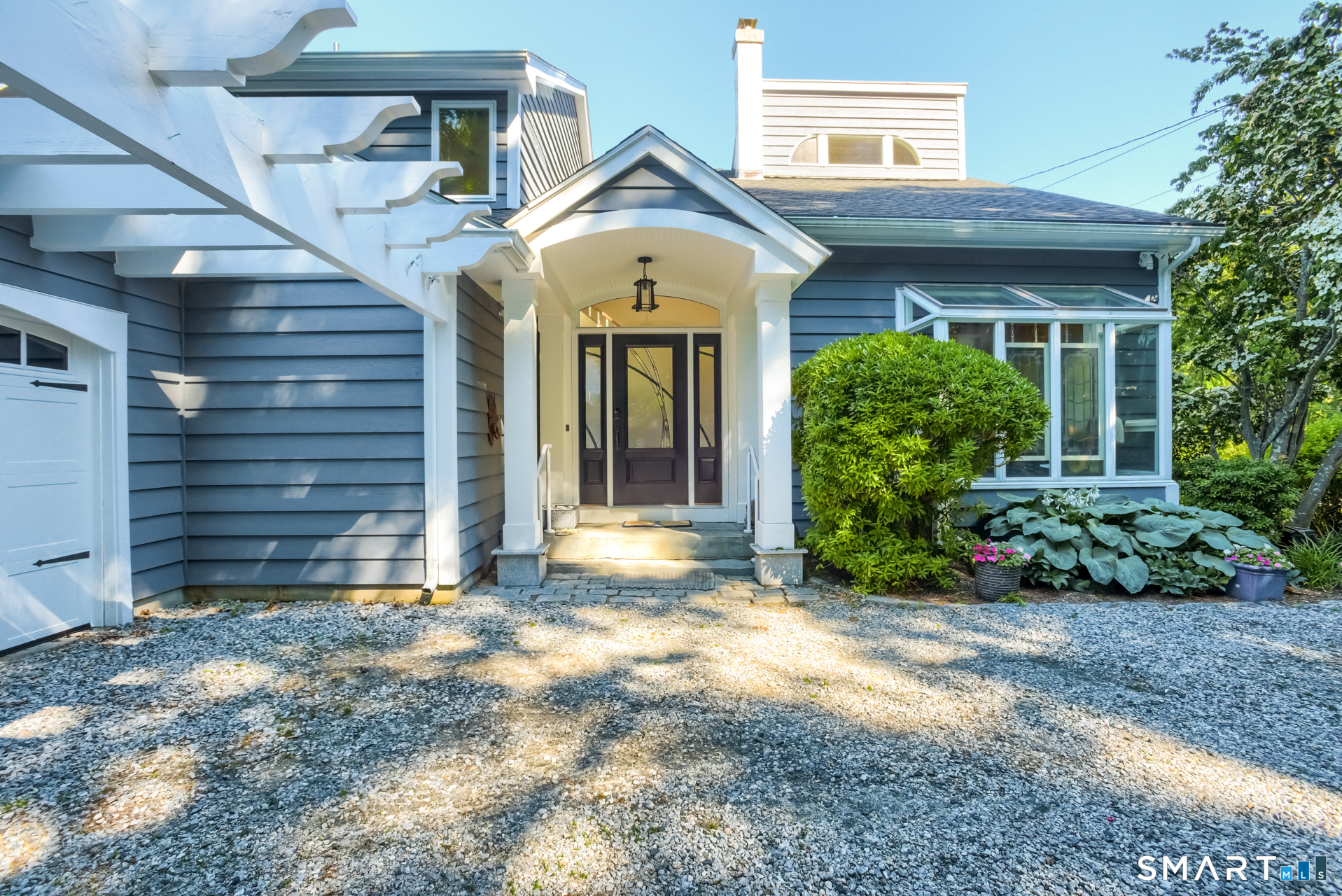 47 Oswegatchie Hills Road East Lyme, CT 06357 - Photo 16 of 40 a view of a house with brick walls and a large windows