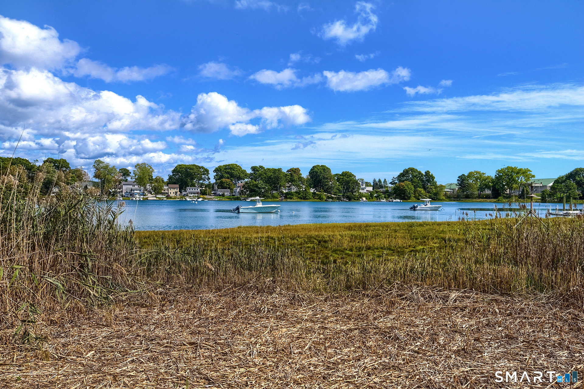 47 Oswegatchie Hills Road East Lyme, CT 06357 - Photo 19 of 40 a view of a lake with houses in the back