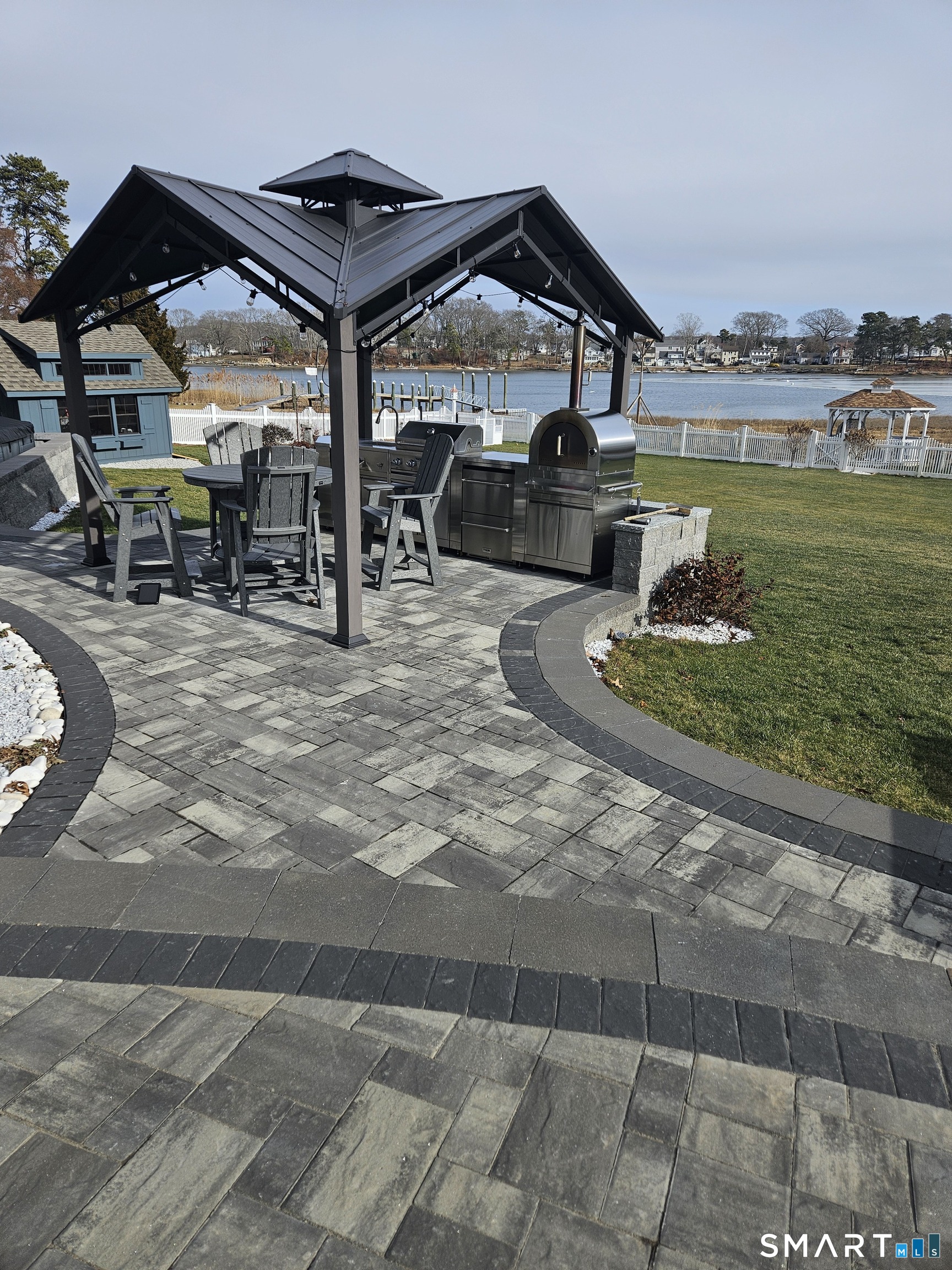 47 Oswegatchie Hills Road East Lyme, CT 06357 - Photo 26 of 40 a roof deck with table and chairs and potted plants