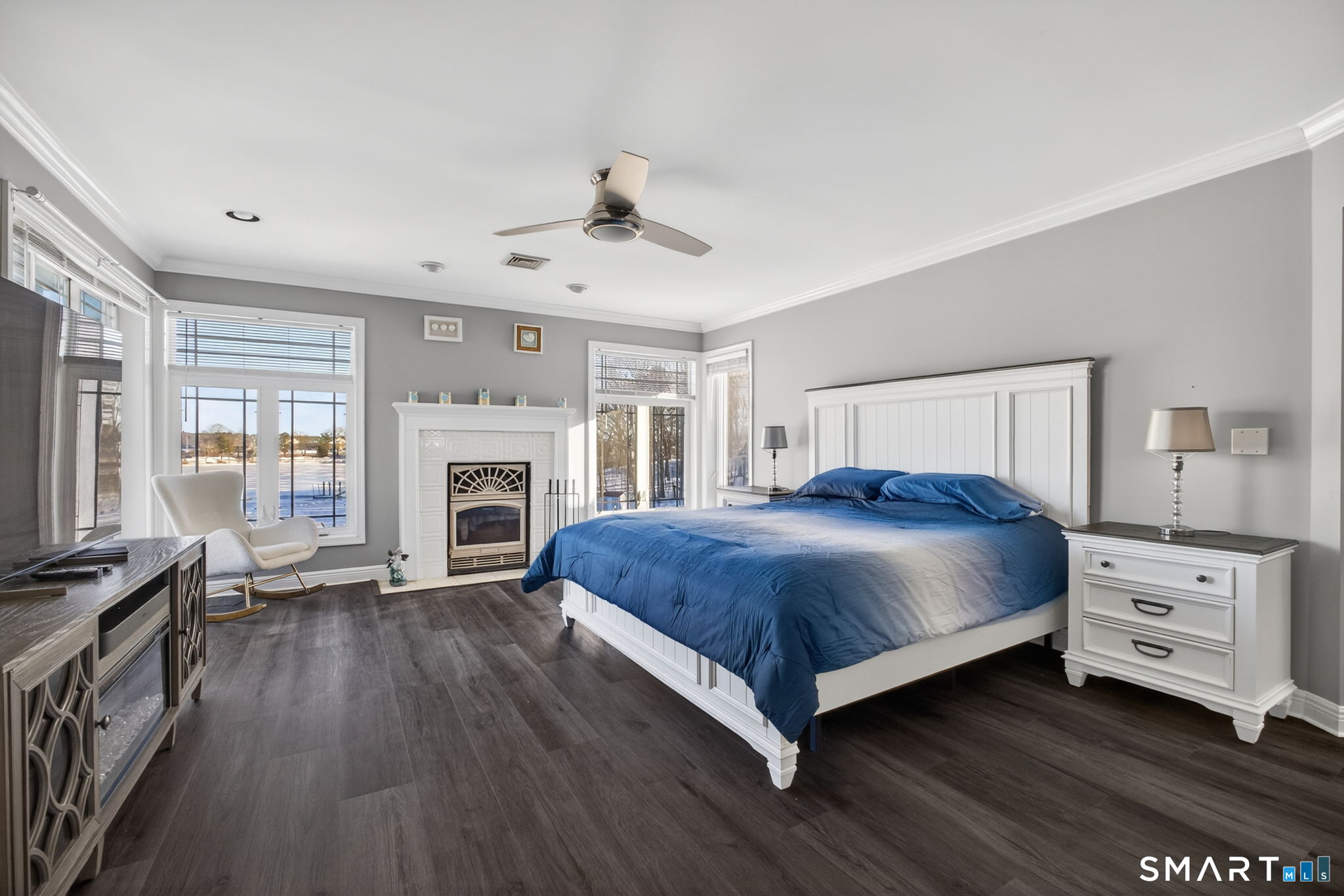 47 Oswegatchie Hills Road East Lyme, CT 06357 - Photo 32 of 40 a spacious bedroom with a bed and a fireplace