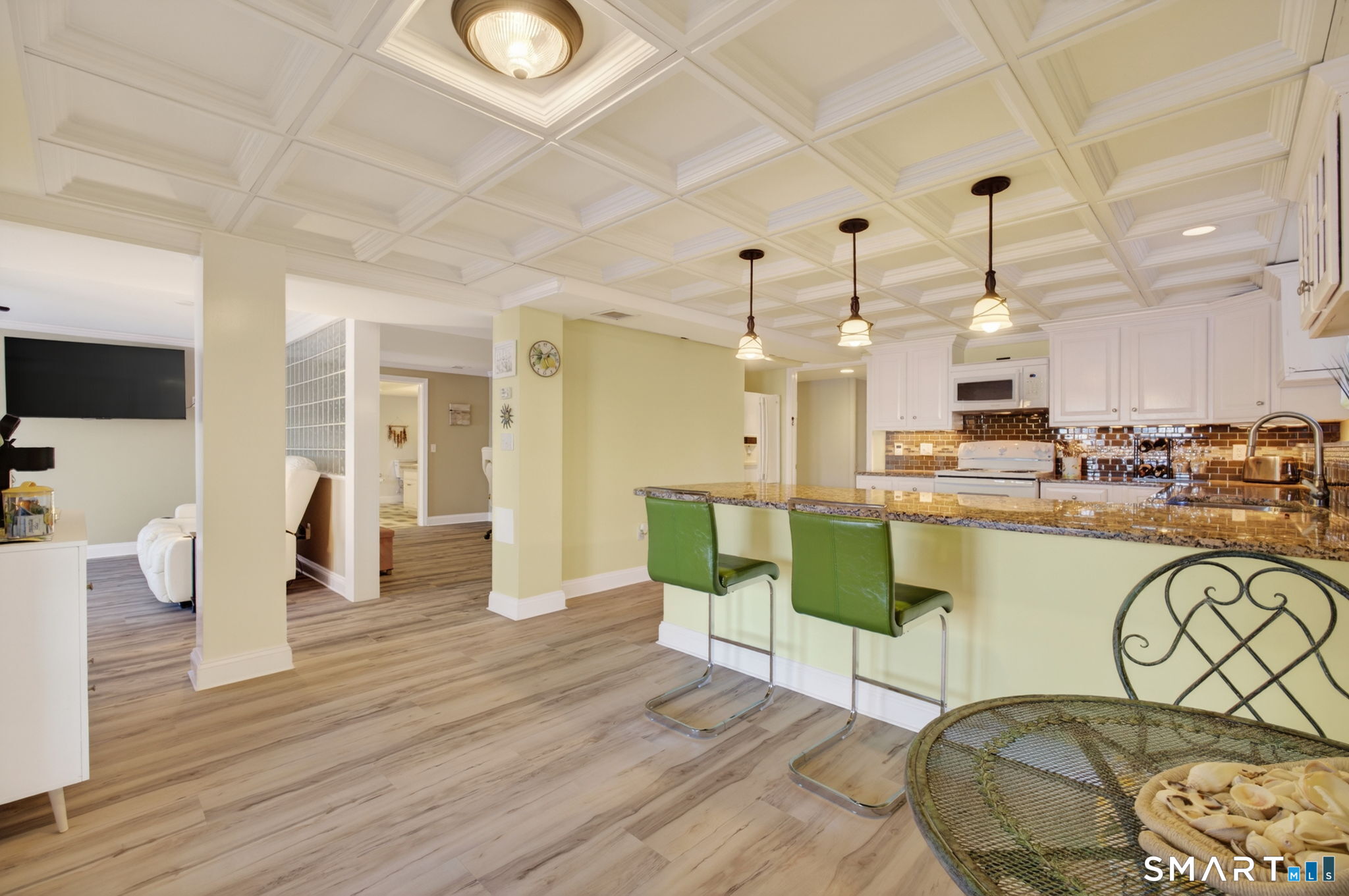 47 Oswegatchie Hills Road East Lyme, CT 06357 - Photo 37 of 40 a living room with lots of chairs and wooden floor