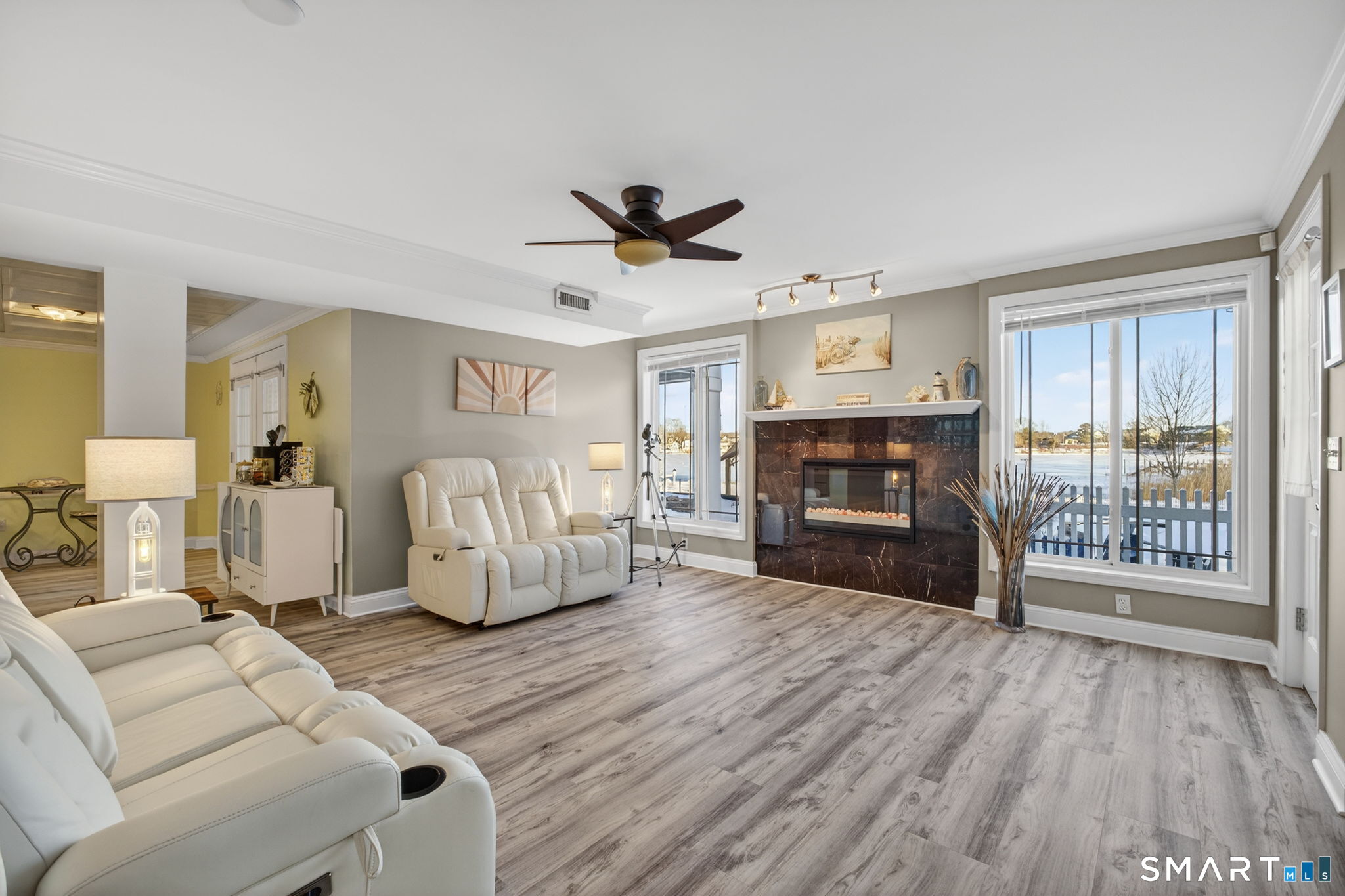 47 Oswegatchie Hills Road East Lyme, CT 06357 - Photo 38 of 40 a living room with furniture a fireplace and a flat screen tv