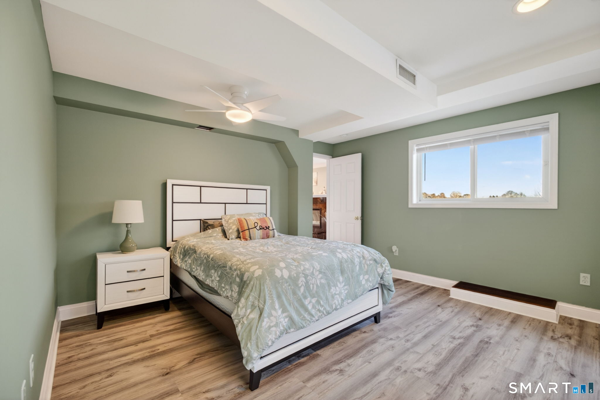 47 Oswegatchie Hills Road East Lyme, CT 06357 - Photo 39 of 40 a bedroom with a bed and a window