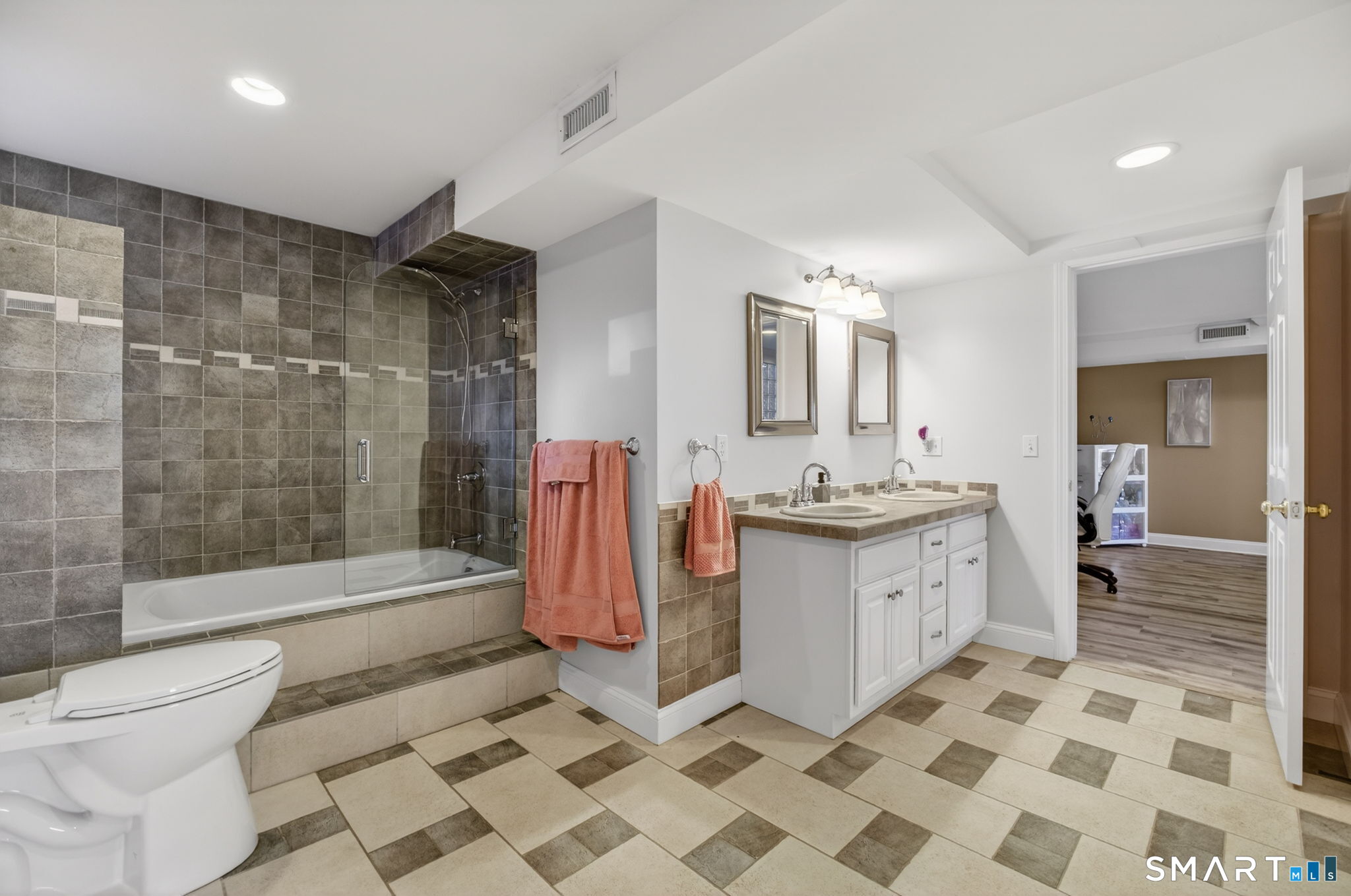 47 Oswegatchie Hills Road East Lyme, CT 06357 - Photo 40 of 40 a bathroom with a sink a toilet a mirror and shower