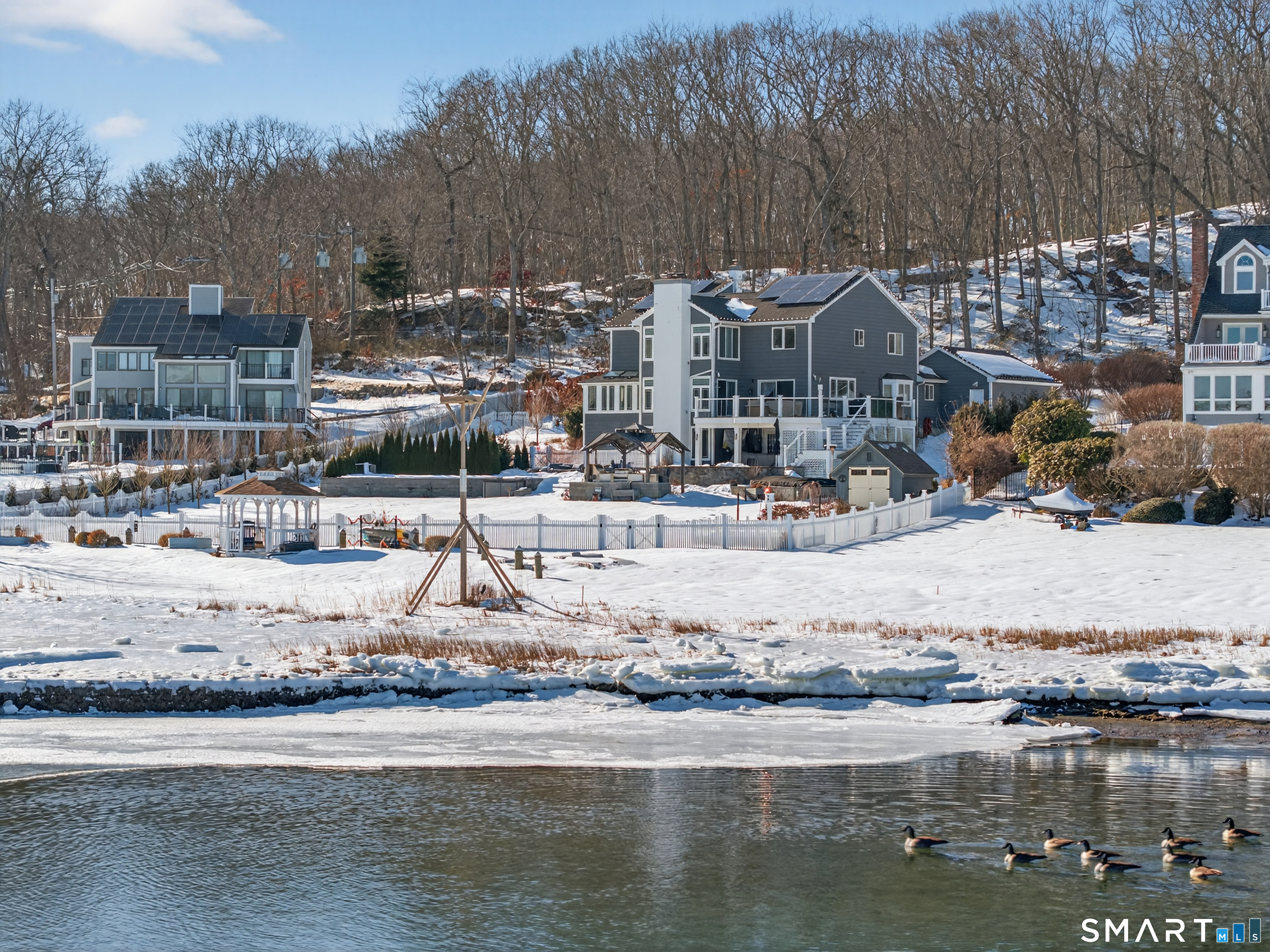 47 Oswegatchie Hills Road East Lyme, CT 06357 - Photo 6 of 40 a building outdoor space with swimming pool and lake view