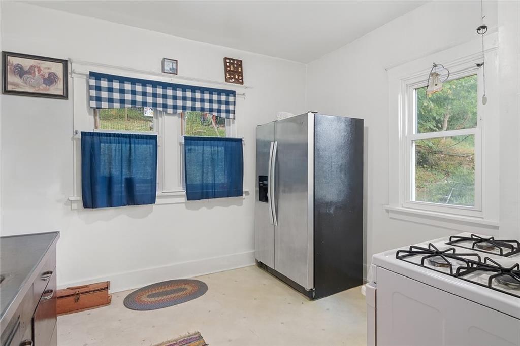 288 Bascom Avenue Pittsburgh, PA 15214 - Photo 16 of 32 a kitchen with stainless steel appliances granite countertop a refrigerator and a stove top oven