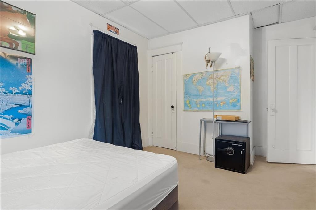 288 Bascom Avenue Pittsburgh, PA 15214 - Photo 22 of 32 a bedroom with a bed and a fireplace