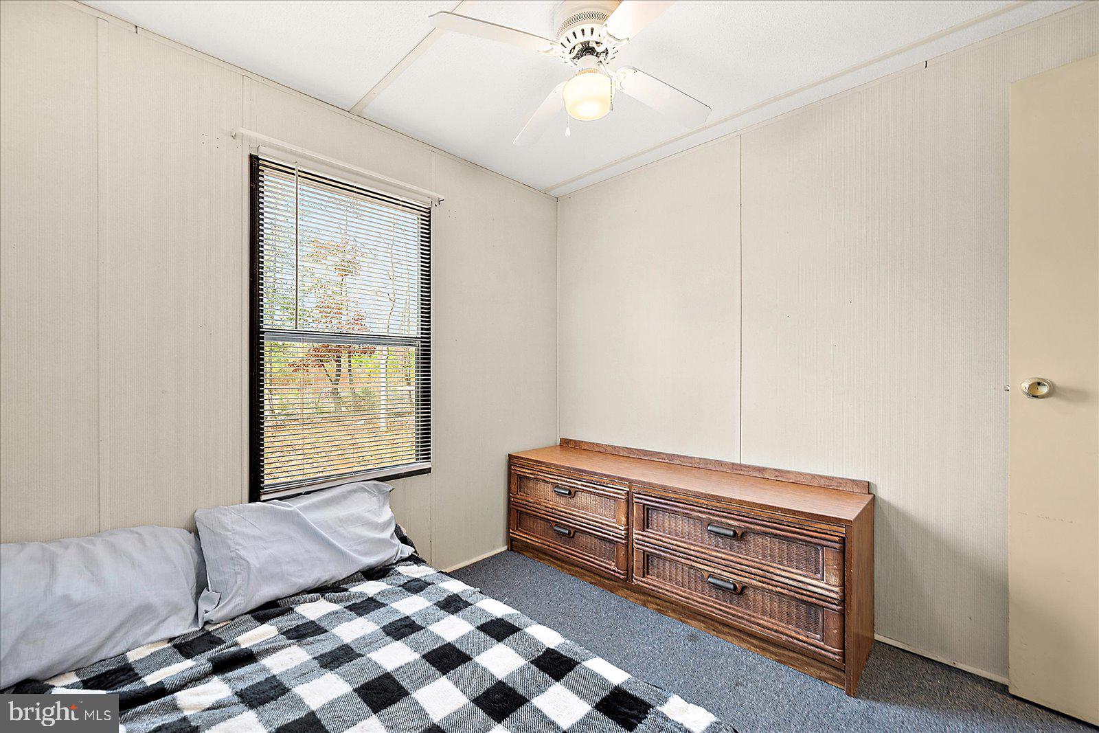 729 Snow Hill Road Stockton, MD 21864 - Photo 16 of 46 a bedroom with furniture and window