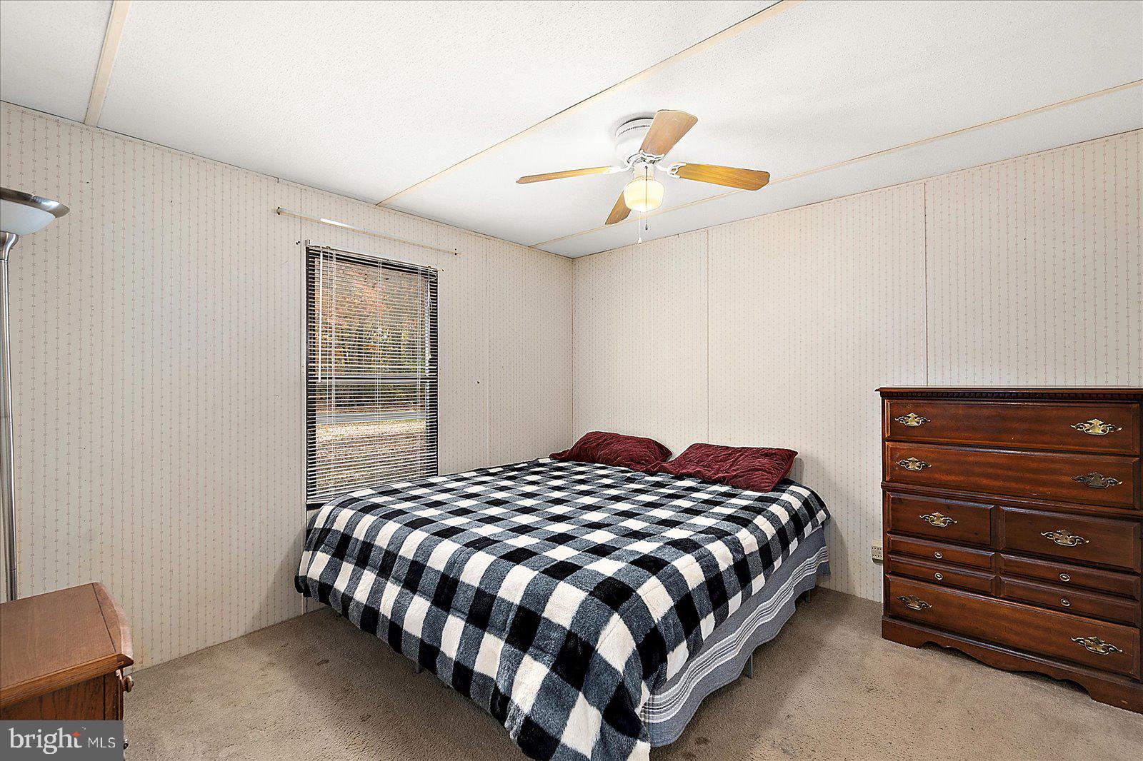 729 Snow Hill Road Stockton, MD 21864 - Photo 19 of 46 a bedroom with a bed and window