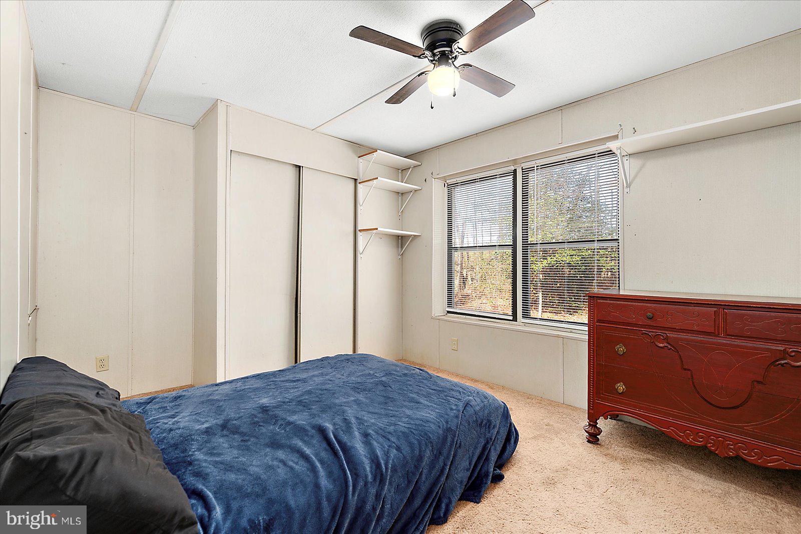 729 Snow Hill Road Stockton, MD 21864 - Photo 22 of 46 a bedroom with a bed and a window