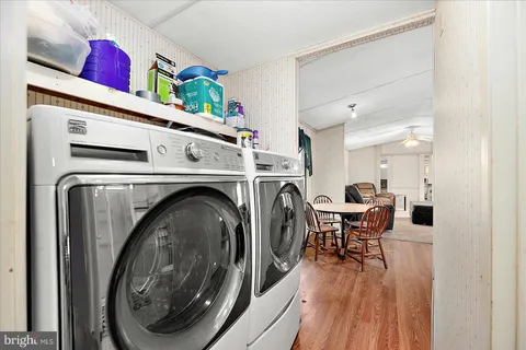 a view of a hallway with washer and dryer