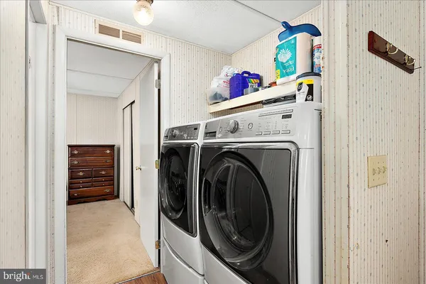 a utility room with dryer and washer