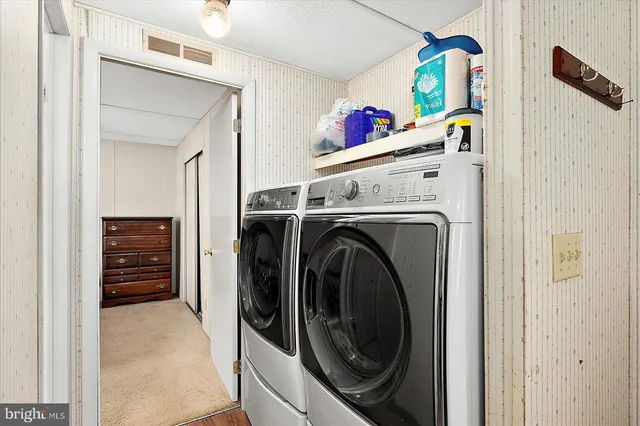 a utility room with dryer and washer