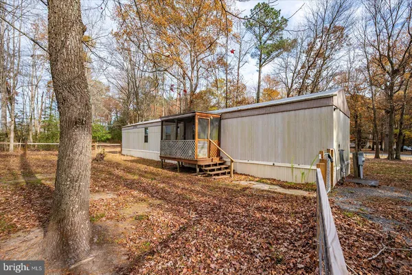 a view of a barn in the back yard