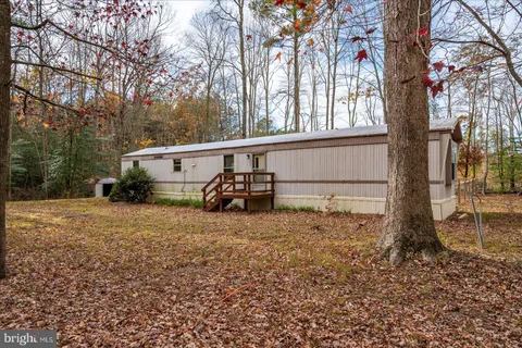 a view of a house with a back yard