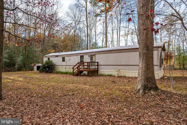 a view of a house with a back yard