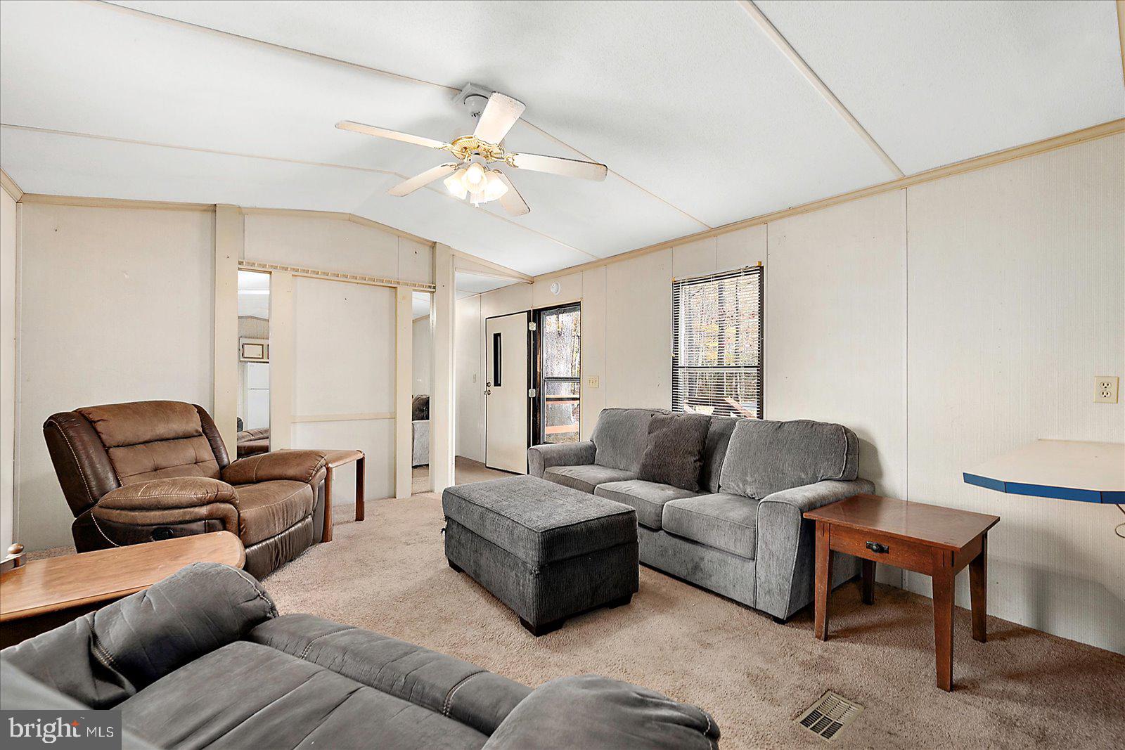 729 Snow Hill Road Stockton, MD 21864 - Photo 4 of 46 a living room with furniture and a wooden floor