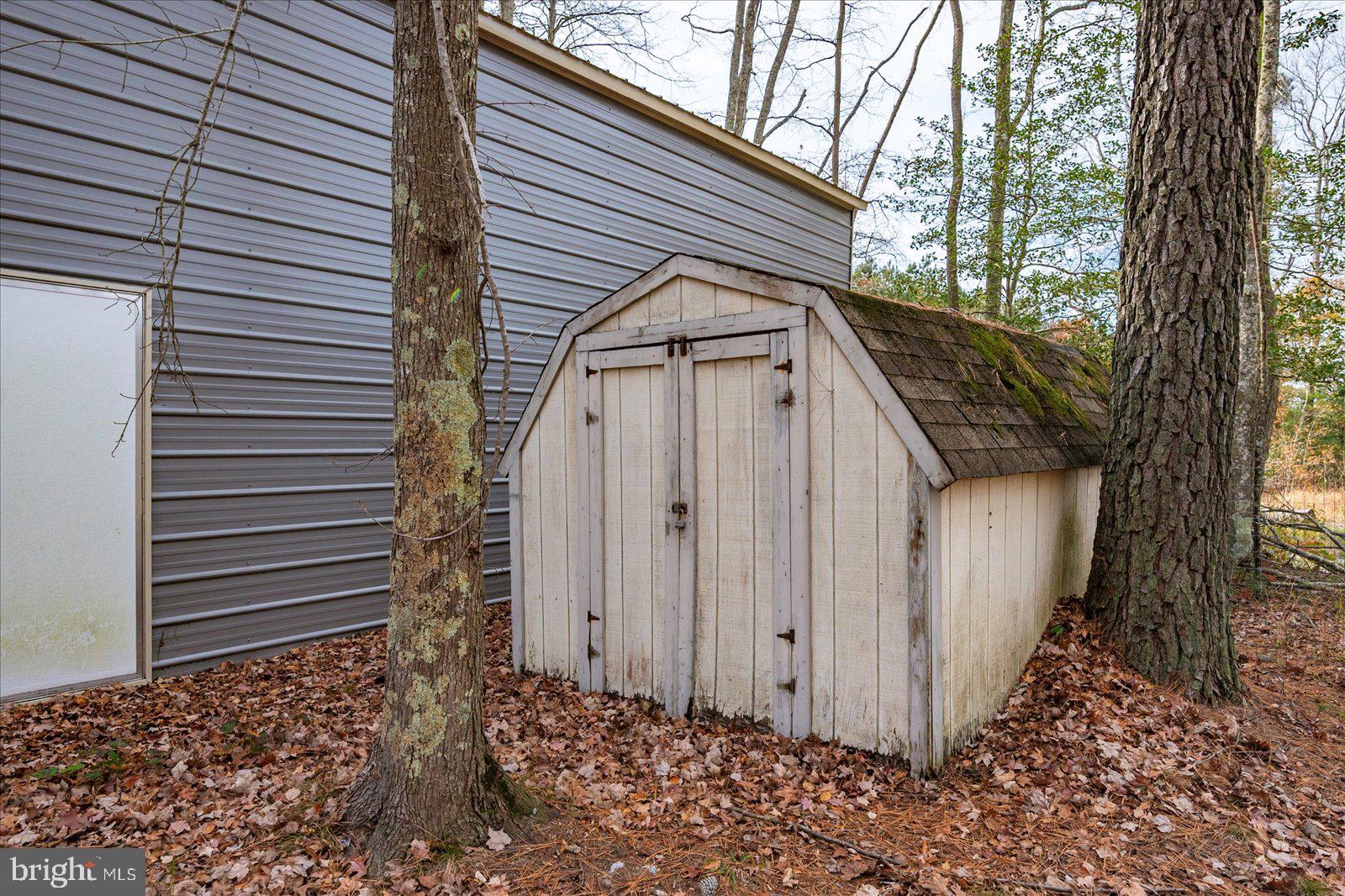 729 Snow Hill Road Stockton, MD 21864 - Photo 43 of 46 a view of a house with a large window and wooden fence