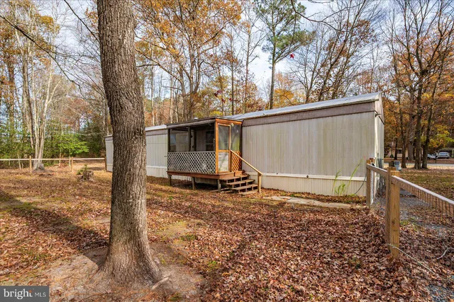 a backyard of a house with barbeque oven