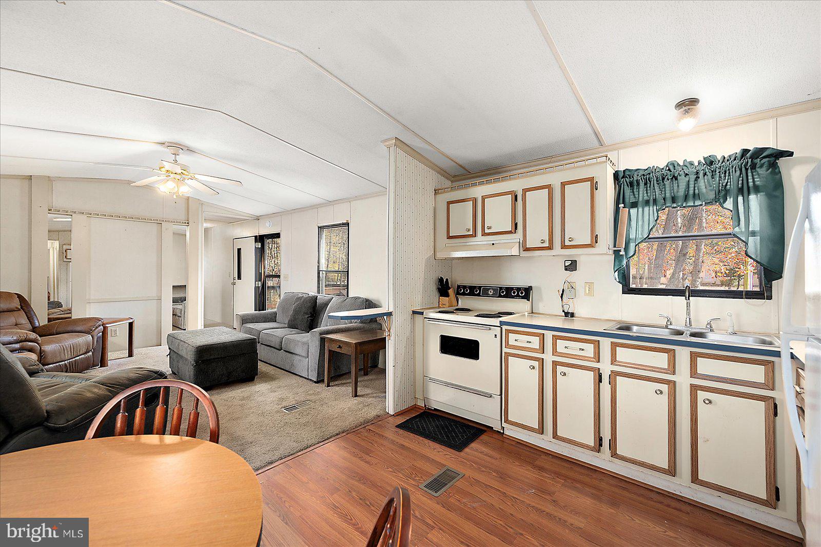 729 Snow Hill Road Stockton, MD 21864 - Photo 10 of 46 a living room with furniture and a large window