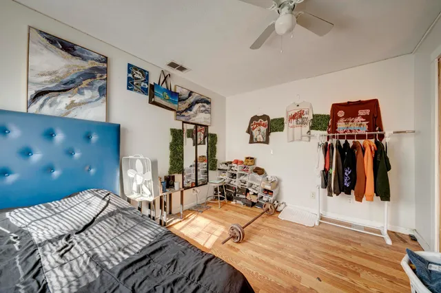 a bed room with a bed and a view of bedroom