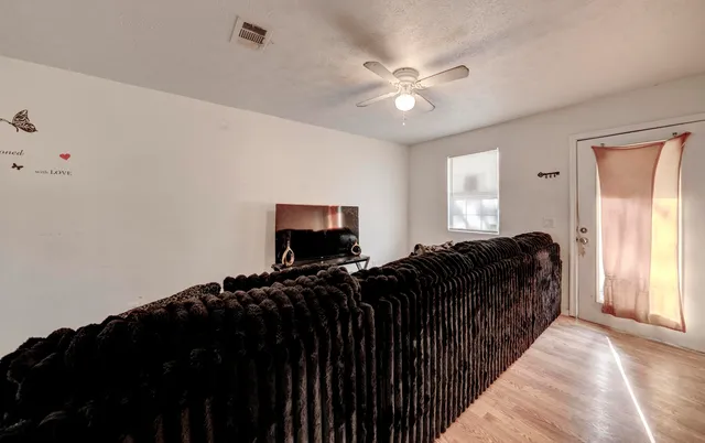 a bed room with furniture and a window