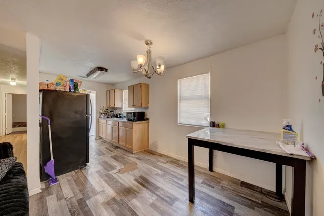 a kitchen with stainless steel appliances a refrigerator and microwave