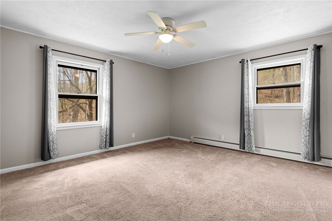 2345 Watauga River Road Sugar Grove, NC 28679 - Photo 14 of 50 an empty room with windows and closet