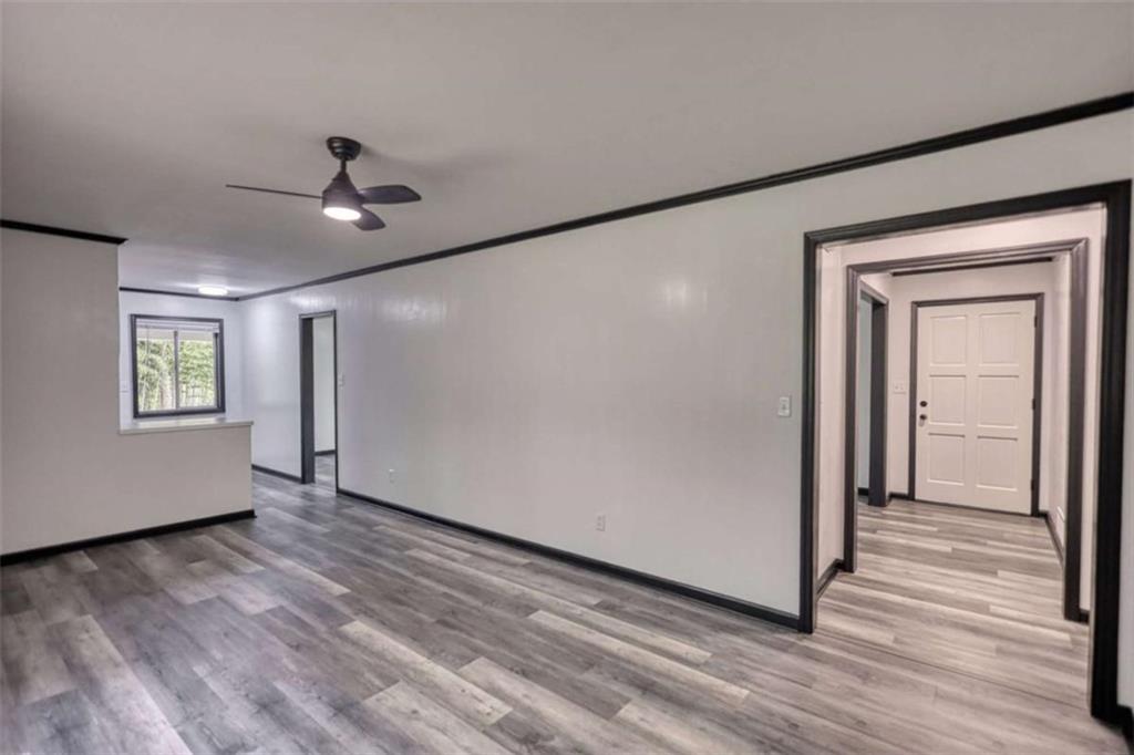 555 Joy Street Jackson, GA 30233 - Photo 20 of 56 a view of empty room with wooden floor