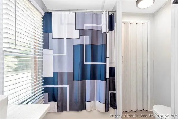 a kitchen with a refrigerator and window