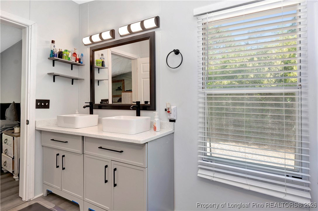 155 Willard Tatum Road Elizabethtown, NC 28337 - Photo 16 of 23 a bathroom with a sink and a mirror