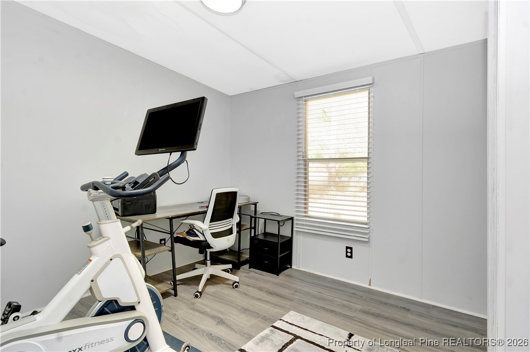 155 Willard Tatum Road Elizabethtown, NC 28337 - Photo 18 of 23 a view of a workspace with wooden floor and a window