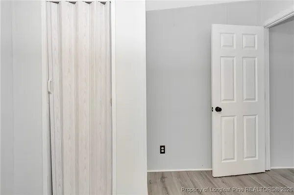 a view of a livingroom with wooden floor