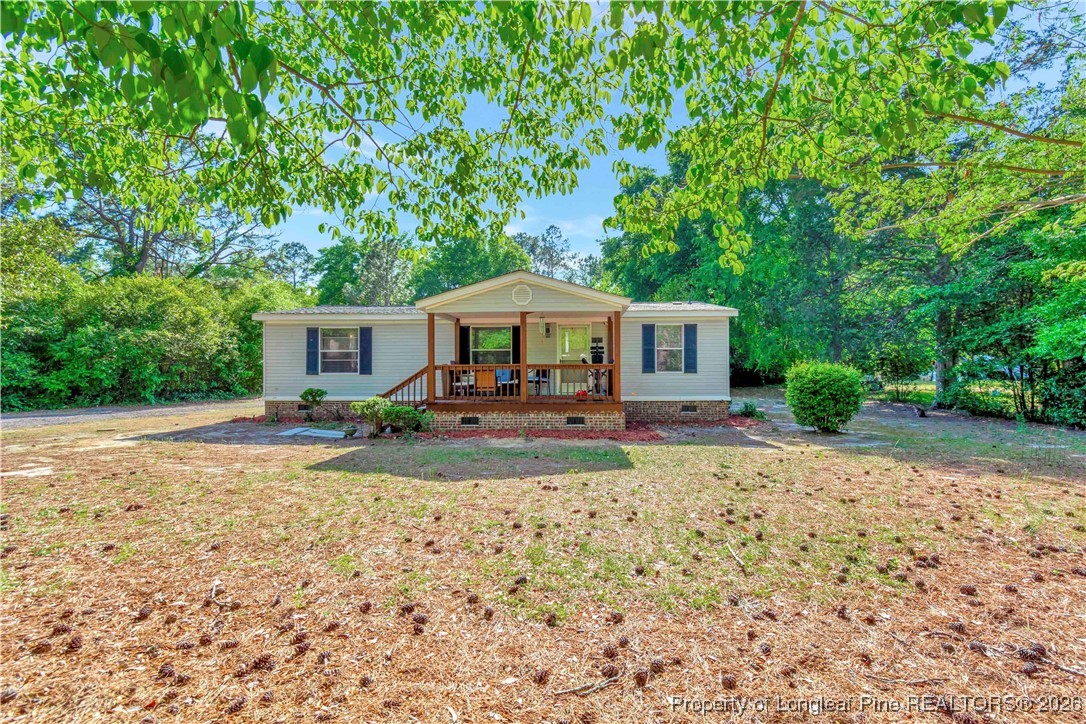 155 Willard Tatum Road Elizabethtown, NC 28337 - Photo 2 of 23 a front view of a house with yard patio and green space