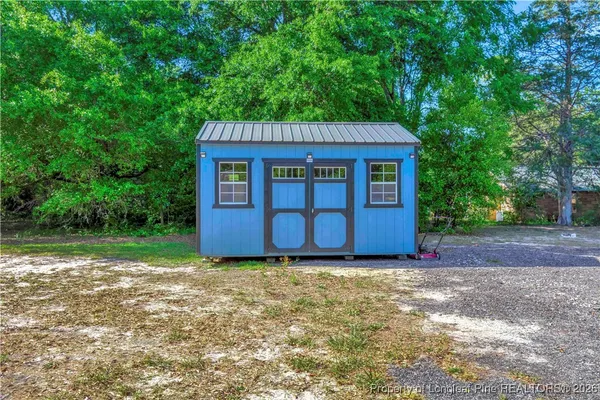 a house view with a backyard space