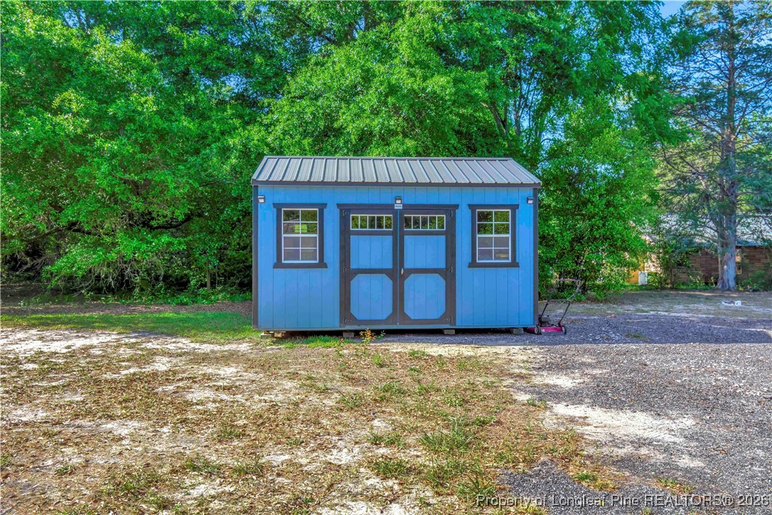 155 Willard Tatum Road Elizabethtown, NC 28337 - Photo 22 of 23 a house view with a backyard space