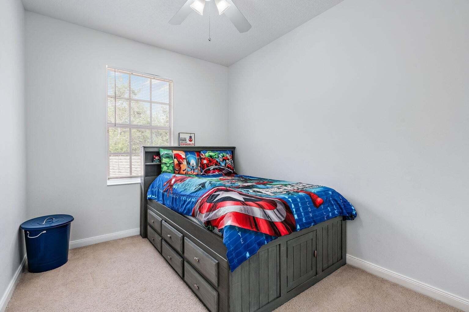 4030 Parkside Drive Jupiter, FL 33458 - Photo 14 of 26 a bedroom with a bed and a window