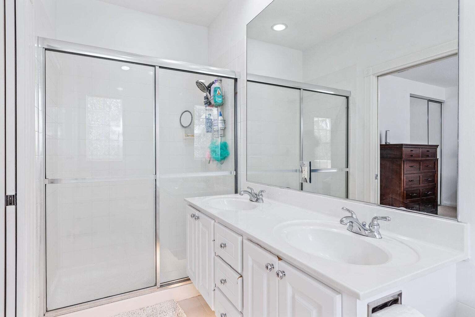 4030 Parkside Drive Jupiter, FL 33458 - Photo 17 of 26 a bathroom with a double vanity sink mirror and double