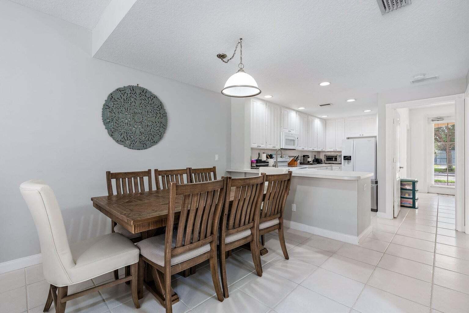 4030 Parkside Drive Jupiter, FL 33458 - Photo 7 of 26 a view of a dining room with furniture
