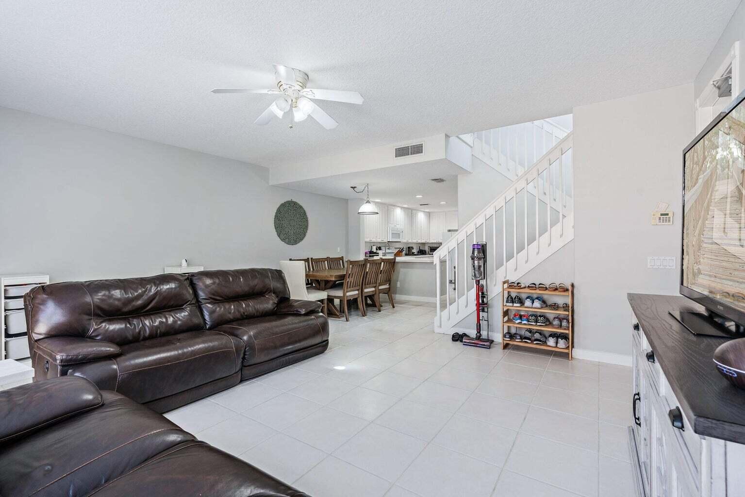 4030 Parkside Drive Jupiter, FL 33458 - Photo 10 of 26 a living room with furniture and a flat screen tv