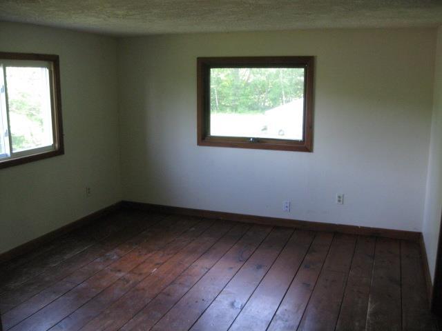 194 Weeks Mills Road South China, ME 04358 - Photo 17 of 27 Master Bedroom with wood floor