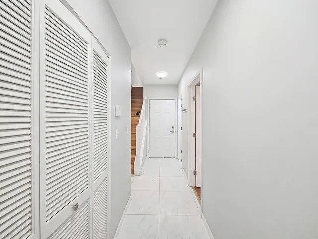 a view of a hallway with a window