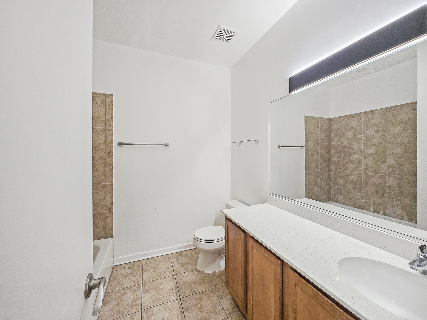 2415 West 32nd Place Chicago, IL 60608 - Photo 20 of 25 a bathroom with a sink a toilet and shower