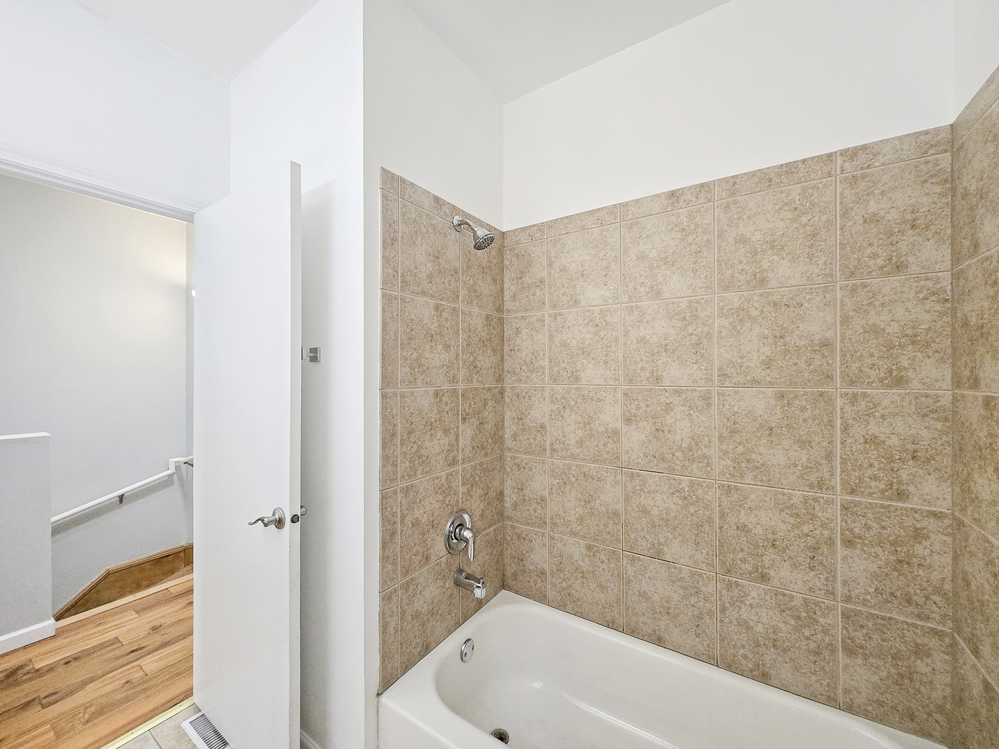 2415 West 32nd Place Chicago, IL 60608 - Photo 21 of 25 a bathroom with a bathtub and shower