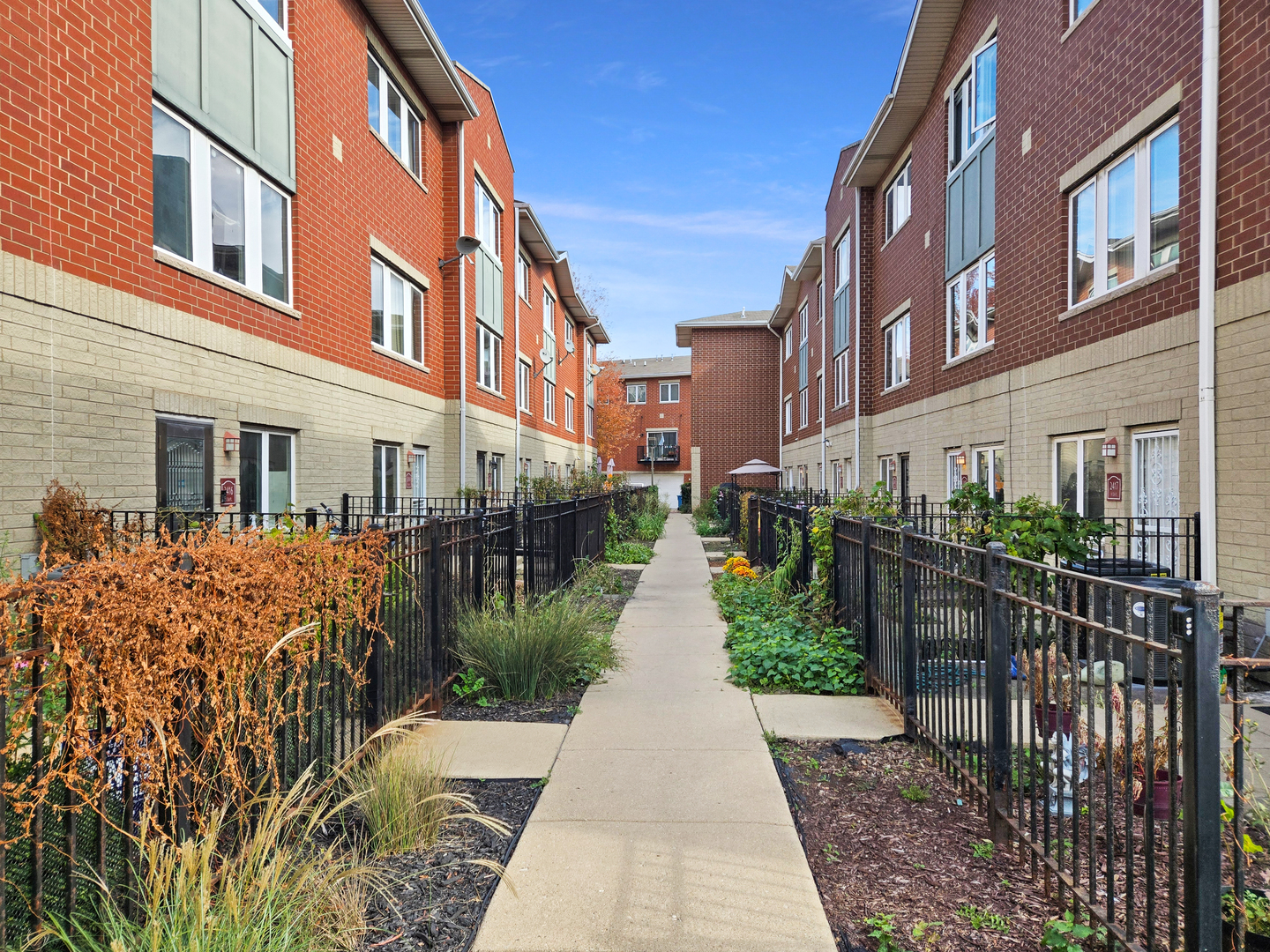 2415 West 32nd Place Chicago, IL 60608 - Photo 24 of 25 a view of a brick building next to a yard