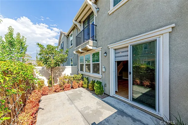 a view of a brick building next to a yard