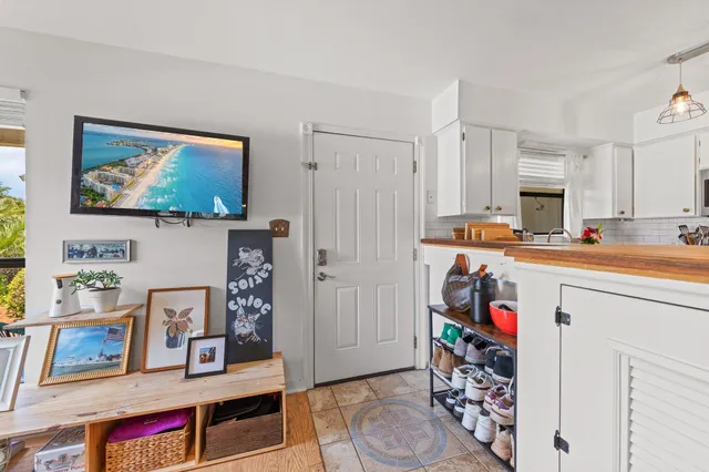 a living room with lots of furniture and decor
