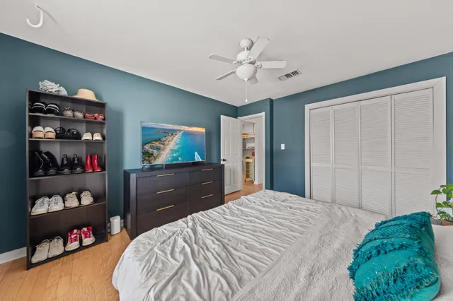 a bedroom with a bed and closet