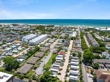an aerial view of city and ocean
